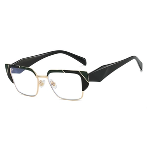 Deep green and black cat-eye glasses with golden metal frame and blue light blocking lenses