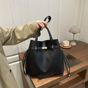 Classic black leather bucket bag with gold metal buckle and vintage drawstring style