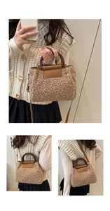 Detail view of plush shearling crossbody bag with vintage brown handle and leather flap