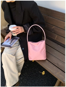 Pink shoulder bag detail showing Hope and future slogan and durable nylon texture
