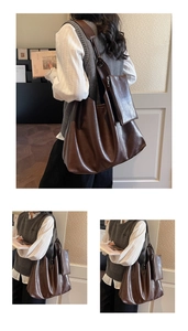 Detail of vintage brown leather tote bag with matching zipper pouch and rich natural texture
