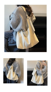 Detailed view of large cream tote bag with soft texture and matching mini pouch