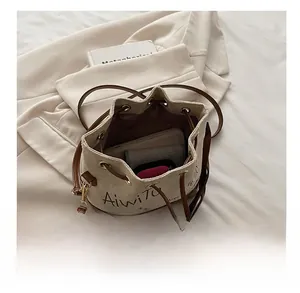 Top view of canvas bucket bag interior showing large capacity and drawstring closure