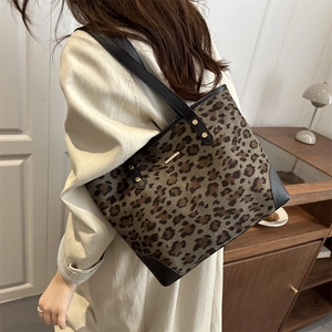 Summer leopard print tote bag with black leather straps and gold hardware detail