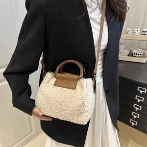 Chic sherpa crossbody bucket bag with round wooden handles and adjustable shoulder strap