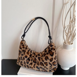 Detail shot of leopard print hobo bag showing soft faux fur texture and rope handle