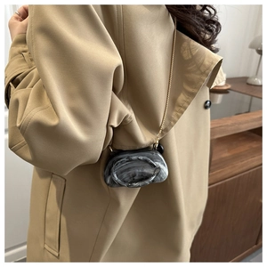 Mini crossbody bag with black-grey marble swirl pattern and elegant gold chain strap