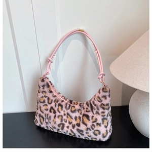 Detailed view of pink leopard print faux fur handbag with soft texture and knotted strap