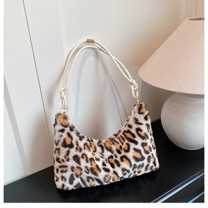 Close-up of leopard print plush tote bag featuring soft faux fur texture and rope handle
