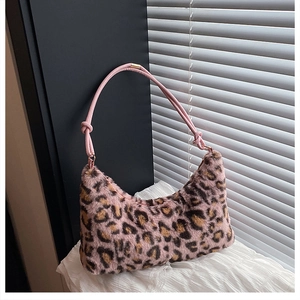 Detail showing soft pink leopard print faux fur texture and knotted rope shoulder strap