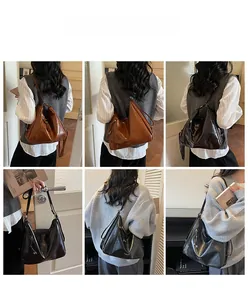 Detailed views of high-capacity leather tote bag in brown and black with tassel zipper