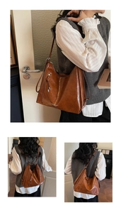 Detail showing versatile brown leather hobo bag convertible from shoulder to backpack