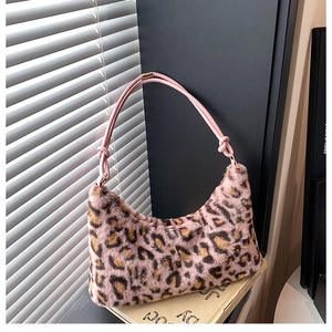 Detail of pink leopard print plush hobo bag with soft faux fur and trendy knot handle