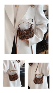 Detail of leopard print crossbody bag with delicate lace handles and bow accents