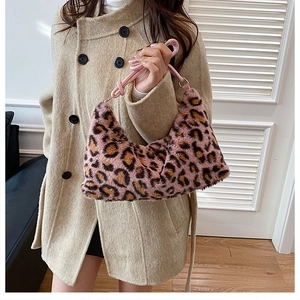 Chic pink leopard print faux fur shoulder bag styled with a warm wool coat