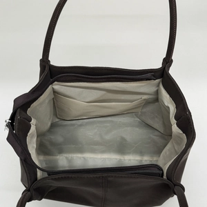 Large vintage brown tote bag for women showing spacious interior with zipper closure