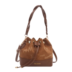 Brown suede bucket bag with stylish graffiti patterns and woven handle for daily commute