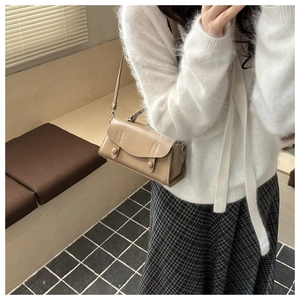 Khaki PU leather small square bag shown with adjustable strap and top handle detail
