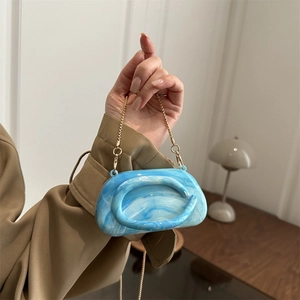 Blue marble texture acrylic round clutch bag with gold chain and metal handle for women