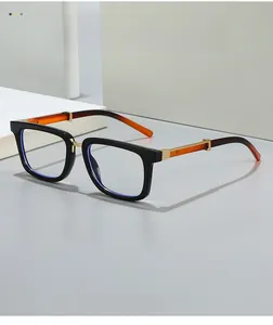 Detailed view of square steampunk frames with amber acetate temples and gold metal hinges