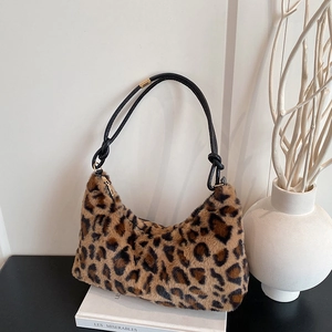 Large leopard print plush hobo shoulder bag with contrast black straps and gold zipper