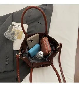 Top view showing the large interior capacity of this brown faux suede crossbody bucket bag