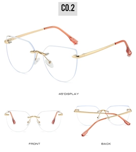 Detailed views of rimless cat eye glasses with gold metal frames and orange earpieces