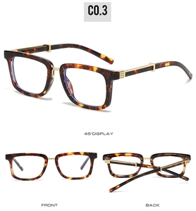 Detail view of tortoiseshell square frames with gold metal hinges and 45-degree display