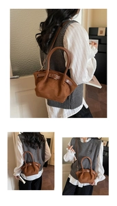 Detailed macro view of the brown faux suede texture and belt buckle decor on the handbag
