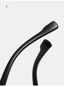 Macro detail of curved black TR90 eyewear arms with comfortable ergonomic arc design