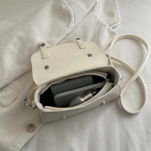 Creamy white vintage small crossbody bag with interior storage for phone and lipstick