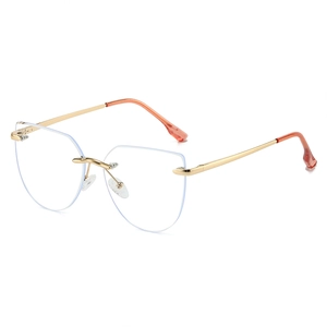 Fashionable rimless cat eye glasses with gold metal frame and reddish brown temple tips