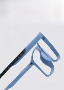Macro detail of blue non-slip eyeglass temples with 52-18-140 sizing and textured finish
