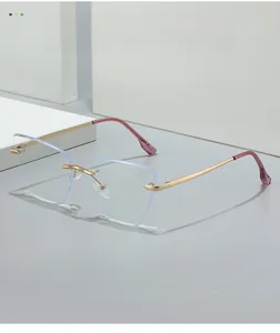 Detail of rimless geometric lenses with blue light coating and gold metal temples