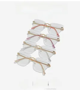 Detail view of stylish rimless eyeglasses with metal gold temples and multicolor tips