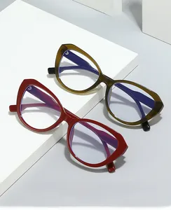 Close-up of cat-eye anti-blue light glasses in olive green and deep red frames