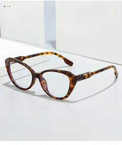 Detail of tortoise cat-eye glasses with classic plaid accent on the temple hinge