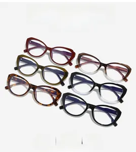 Detailed close-up of cat-eye glasses showing various colors like tortoiseshell and gradient