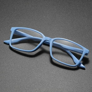 Lightweight light blue rectangular full-frame reading glasses on a grey matte surface
