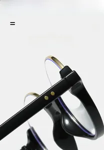 Detail of round half-frame glasses with golden metal rivets and anti-blue light coating