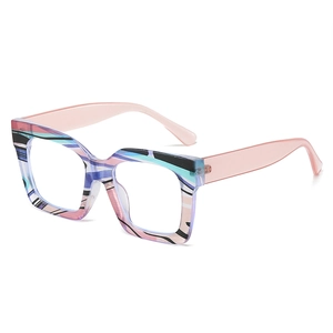 Oversized square blue light glasses with colorful striped frames and pink temples