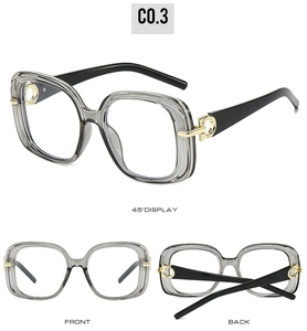 Detail view of square glasses frames with grey transparent front and gold metal hinge