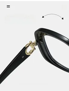 Detailed close-up of durable golden metal hinge on black square-frame sunglasses