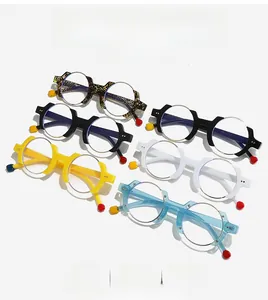 Matrix display of multi-colored geometric half-frame eyewear with colorful temple charms