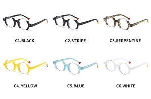 Macro display of six colorful round eyeglass frames with red spherical temple tips
