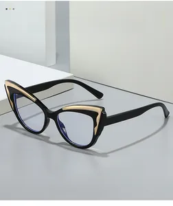Close-up of cat-eye frames with elegant golden metal wing accents and blue light lenses