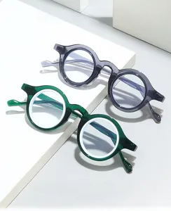 Retro small round glasses frame in translucent smoky grey and deep forest green