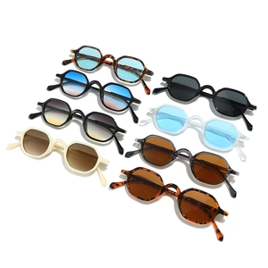 Multiple stylish retro hexagonal sunglasses in various frame colors on white background