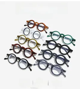 Flat lay of vintage thick round frames in multiple colors like tortoise and olive green