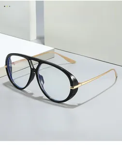 Detail of oversized pilot glasses featuring thick black frames and gold metal temples